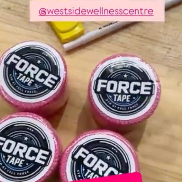 Four rolls of Force tape on a wooden surface with 'westsidewellnesscentre' branding.